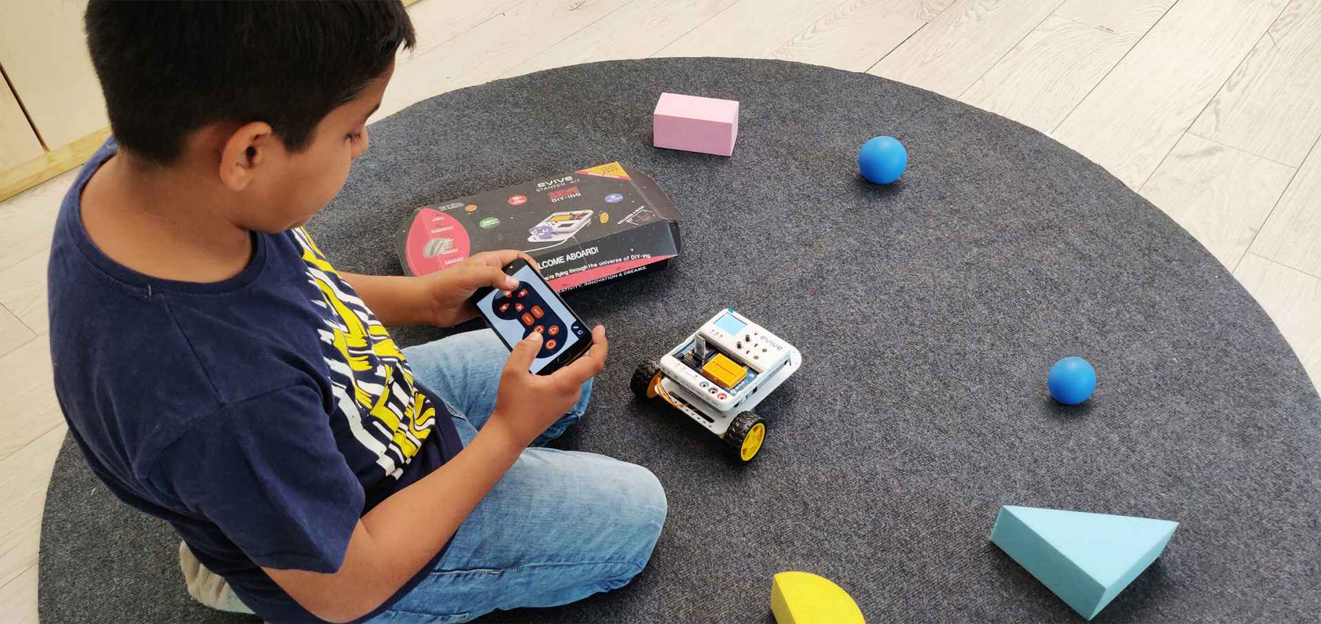 Student Playing Robot Dabble Boy