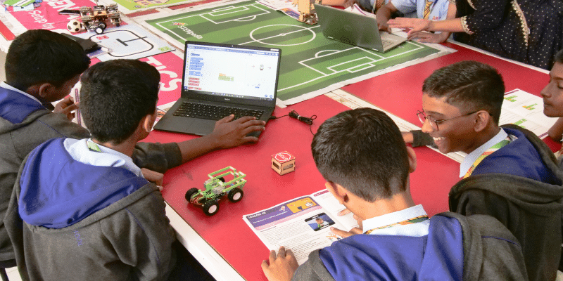 Students practicing block coding and Robotics from Skillful Minds book