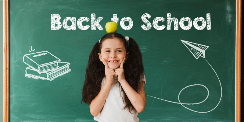 Happy girl in front of chalkboard, celebrating innovative technology in education in schools