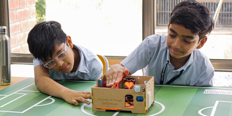 Students of Apple Global School using STEMpedia's IoT House Kit, demonstrating the technology in education