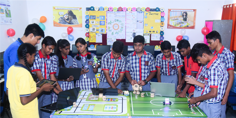 PM Shri School KV students engaged in a robotics lab, utilizing AI and robot kits to enhance 21st-century skills