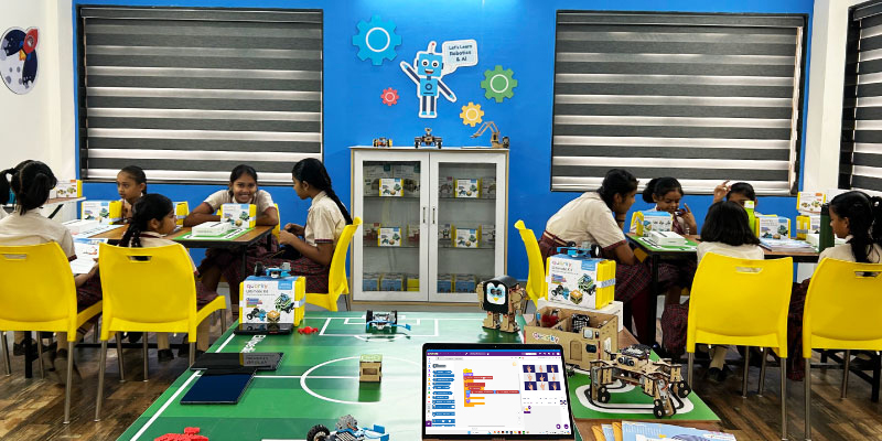 Image Showcasing Student Engagement with AI, Coding, and Robotics in a Composite Skill Lab