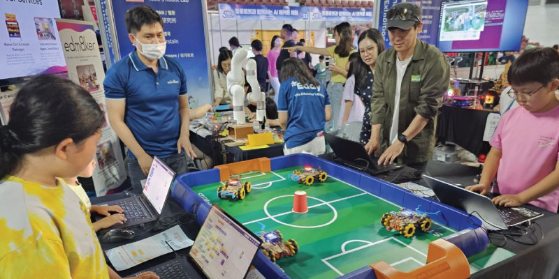 Students Competing in a Robotics Competition with Mecanum Wheel Robot