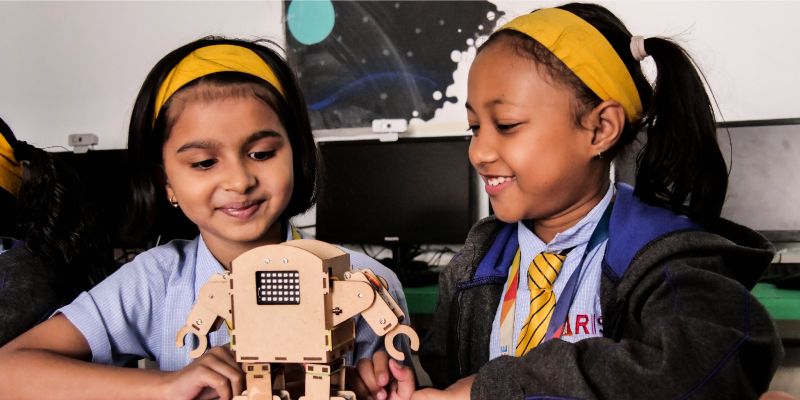 Eight-year-old school girls engaging with a humanoid robot