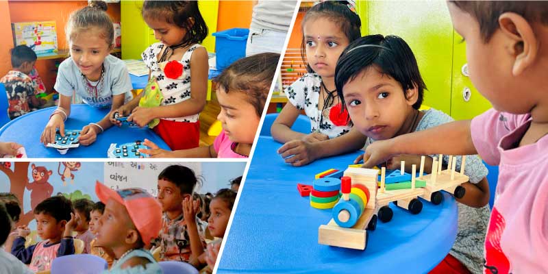 Children engaging with various smart learning tools like Wizbot, smart TV, and play-based kits in a vibrant Anganwadi classroom
