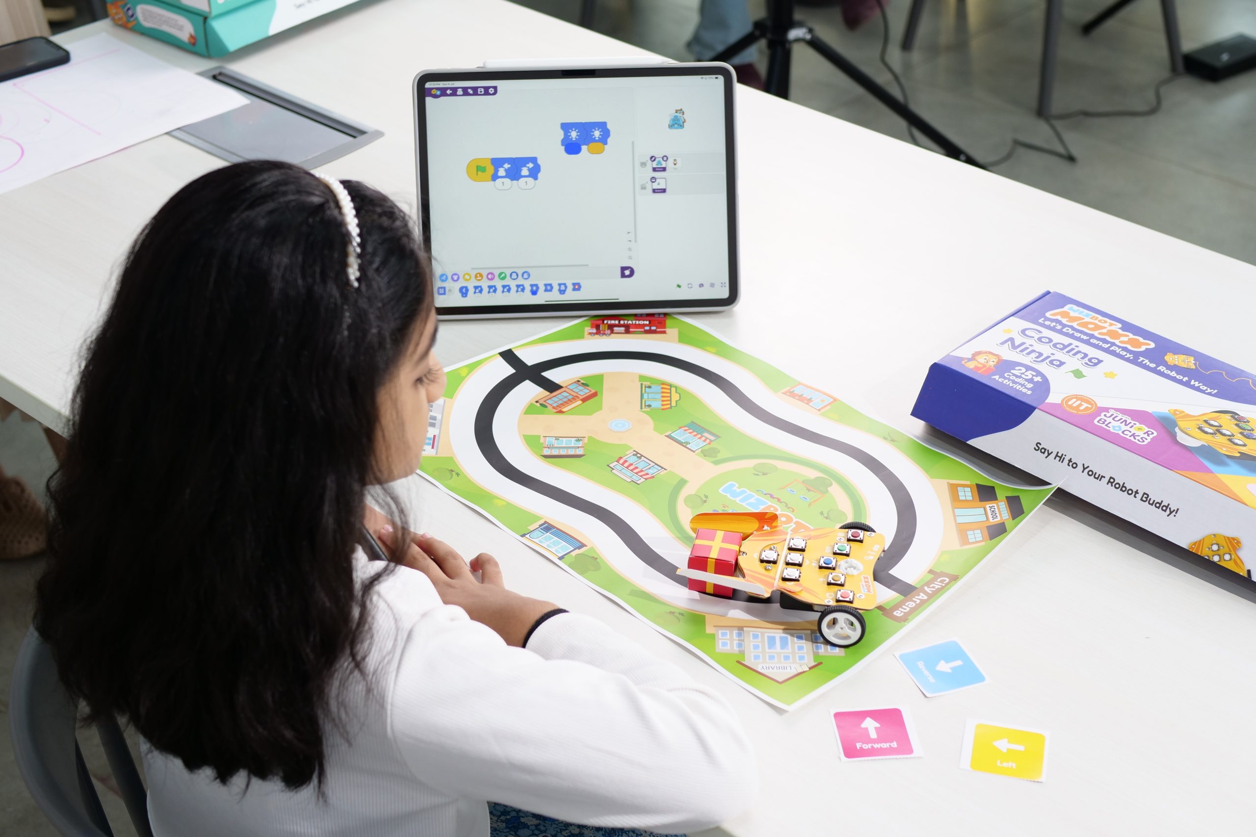 Kid playing with Delivery Wizbot