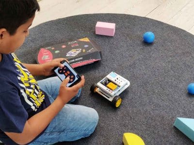 Student Playing Robot Dabble Boy